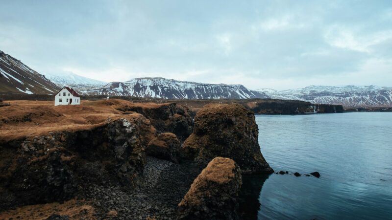 White house on a cliff above the sea