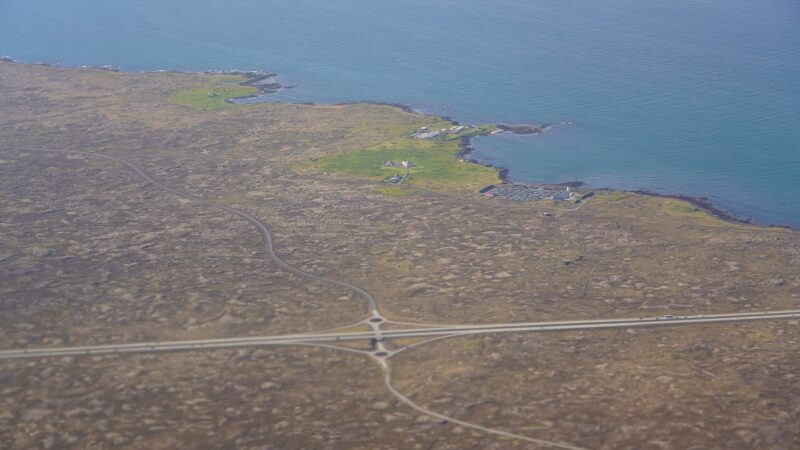 stormy coastal scene over Faxaflói and South Iceland with wind-swept travel disruption