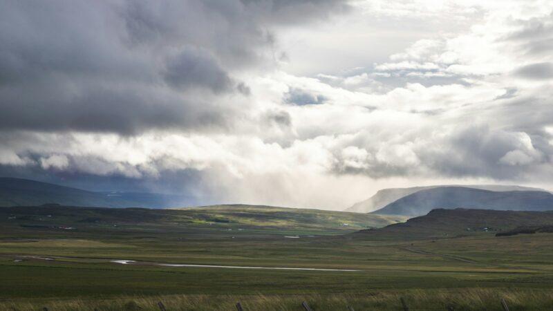 Farmland under storm clouds on Snæfellsnes
