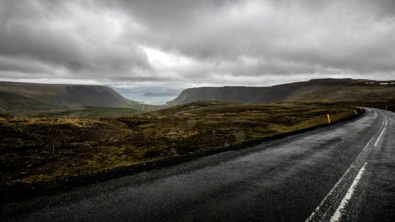 A road through the Westfjords under heavy skies