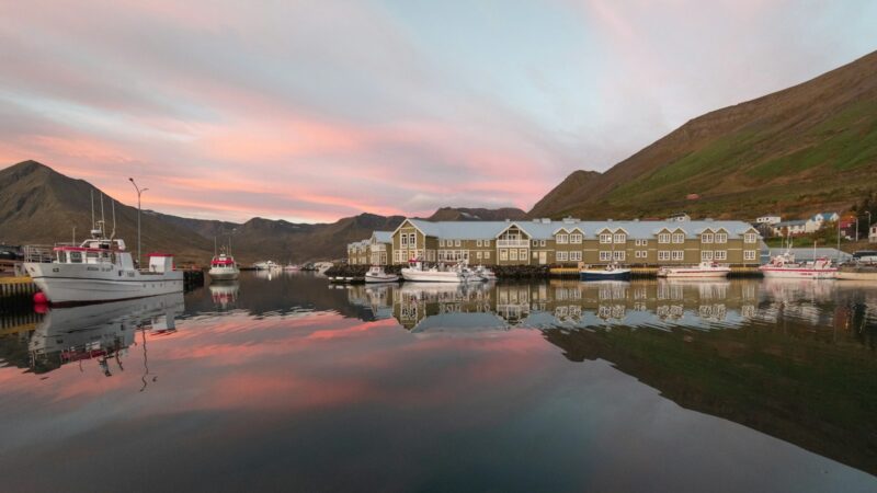Siglufjörður harbour at dusk reflected in still water