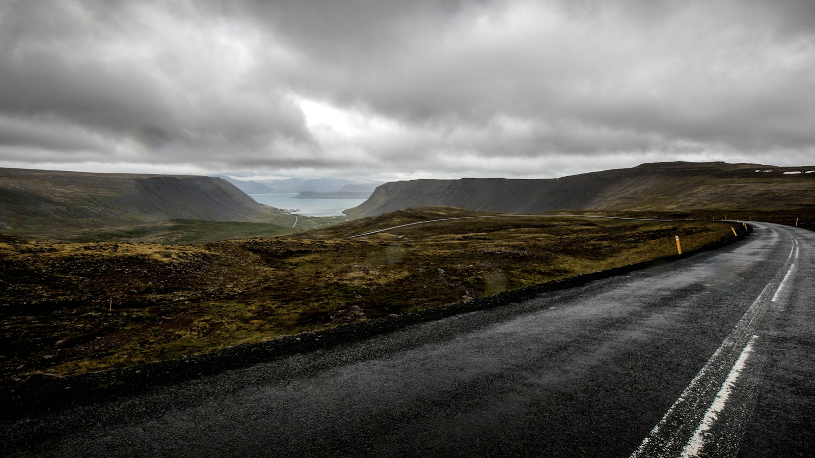 A road through the Westfjords under heavy skies