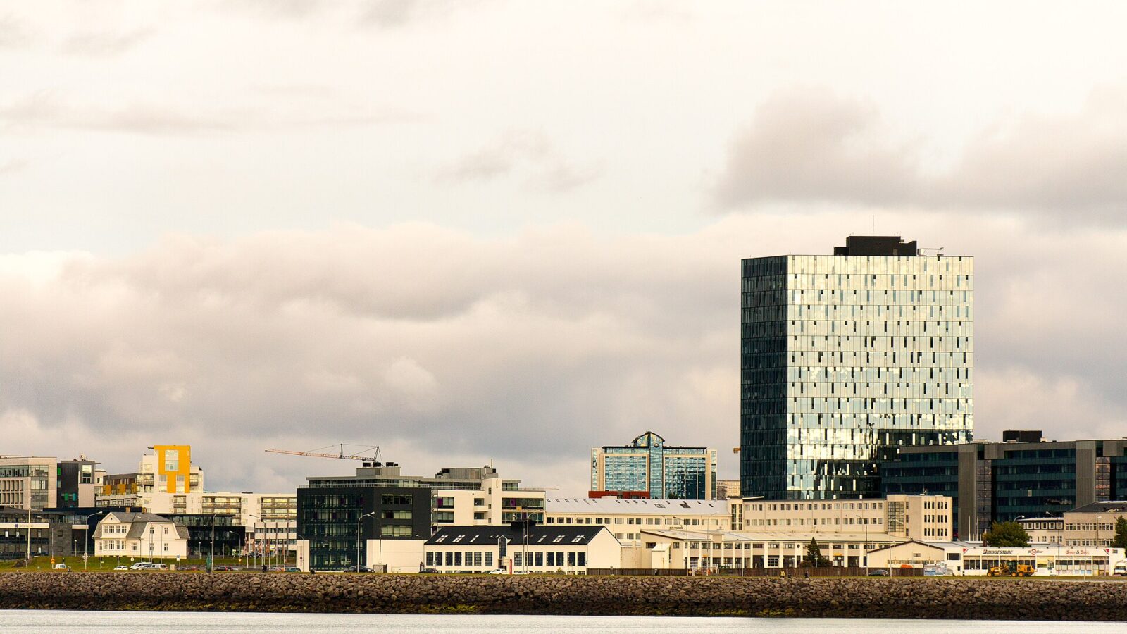 City skyline with tall glass office tower (Central Bank of Iceland)
