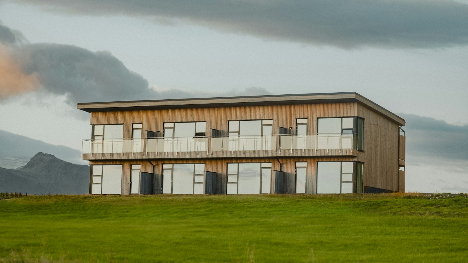 Modern two-storey timber building with balconies