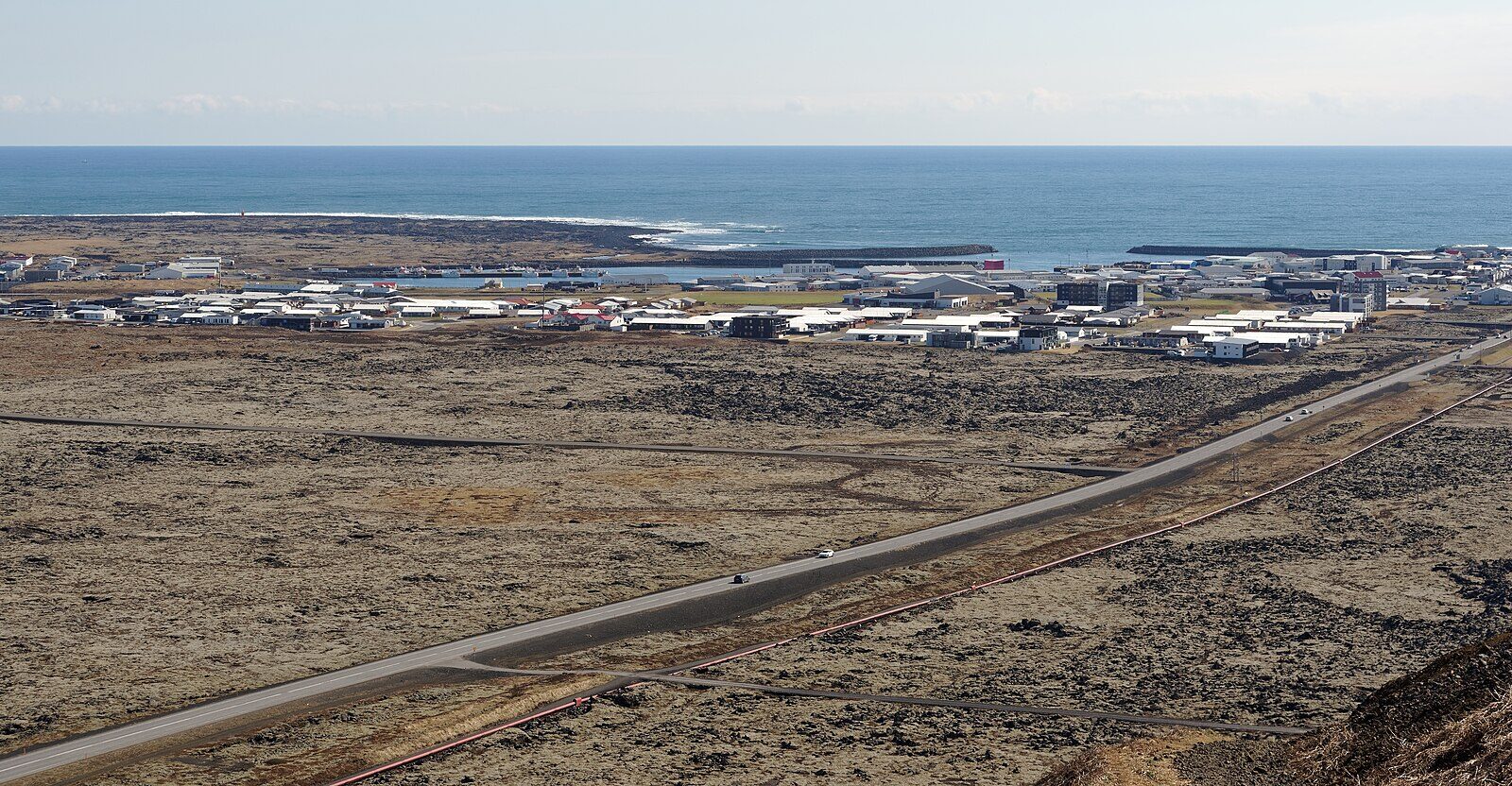 Coastal town and harbour seen from higher ground (Grindavík)