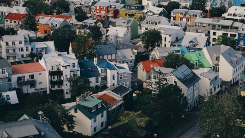 Dense rooftops and colourful houses seen from above