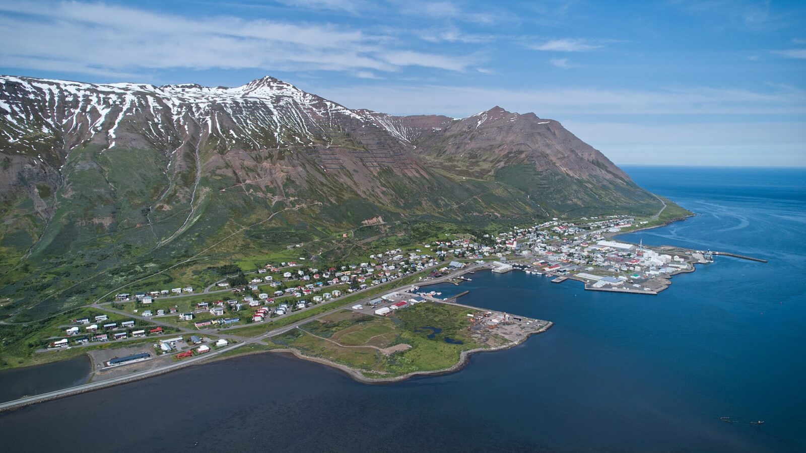 Aerial view of the town, harbour and surrounding mountains (Siglufjörður)