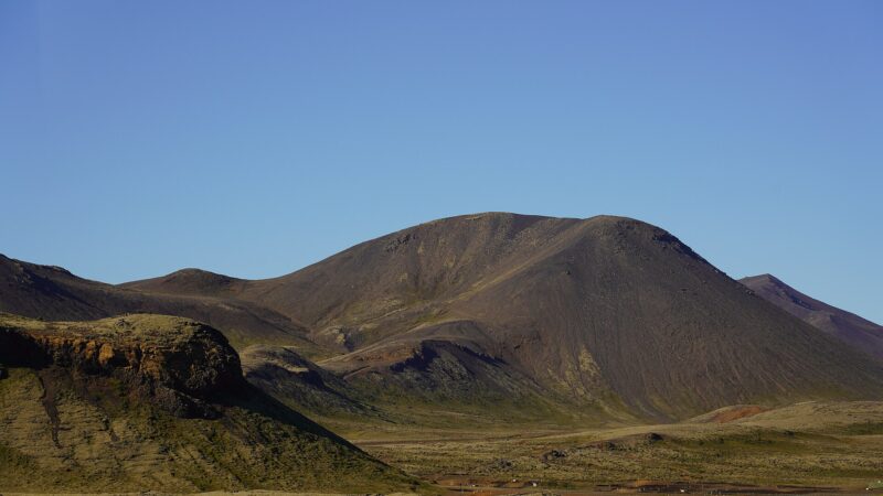Bare volcanic ridge against clear sky (Hellisheiði)