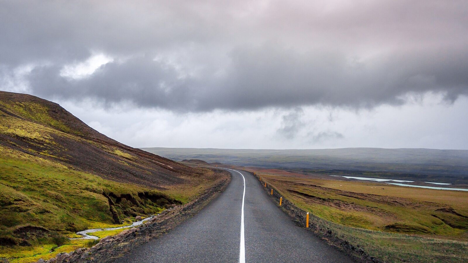 Remote road stretching into an open Icelandic landscape
