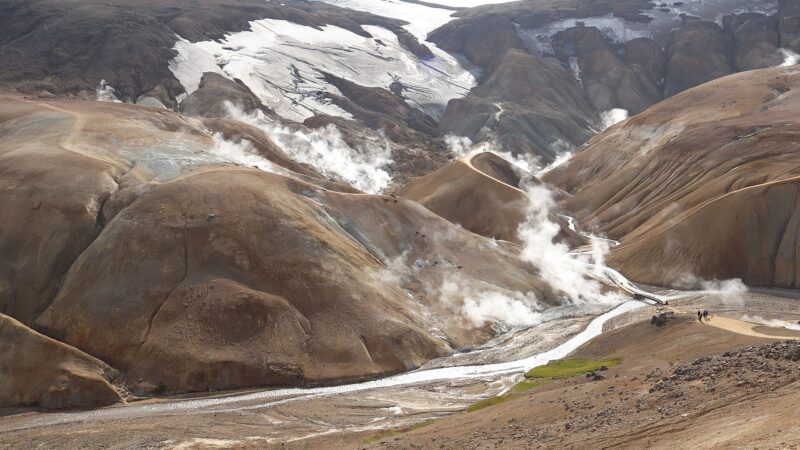 Geothermal valley with steam rising from fumaroles and a winding path (Kerlingarfjöll)
