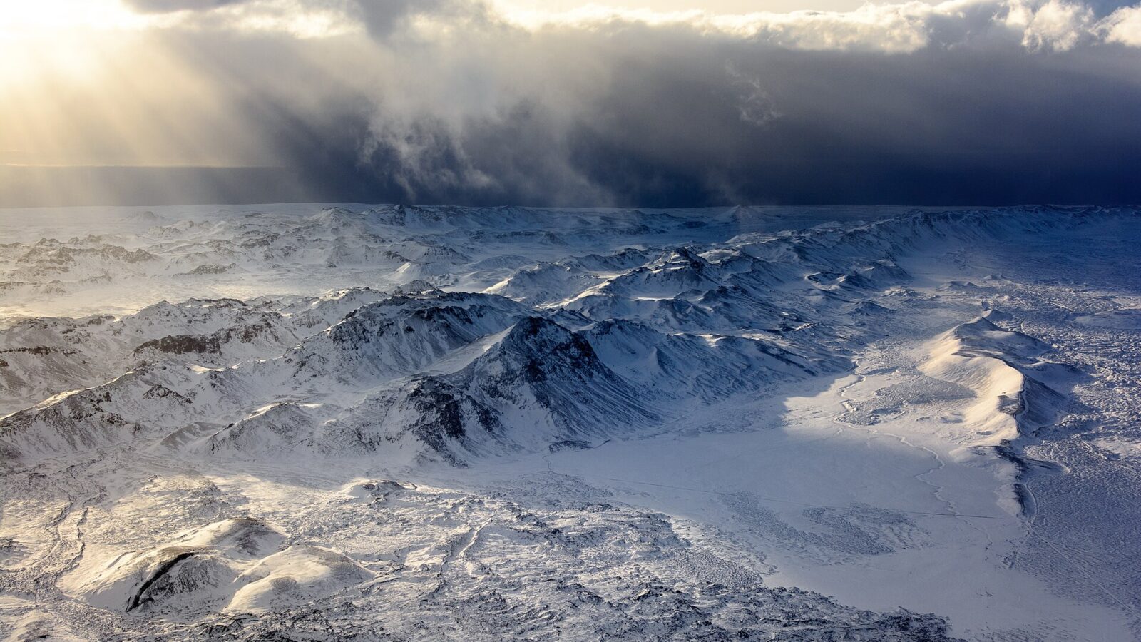 Snow-covered volcanic ridges and glacier fields