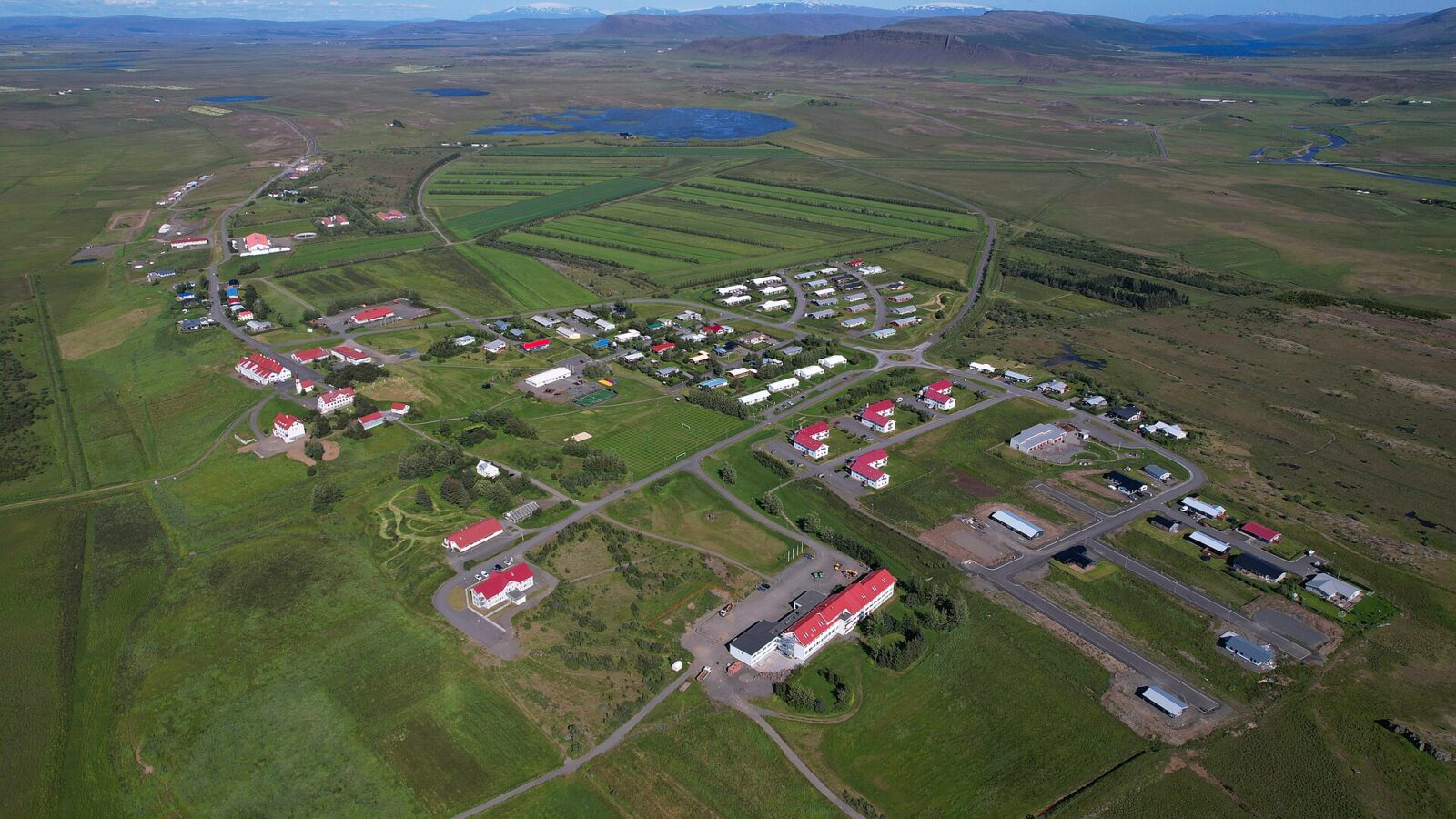 Aerial view of campus buildings and surrounding farmland (Hvanneyri)
