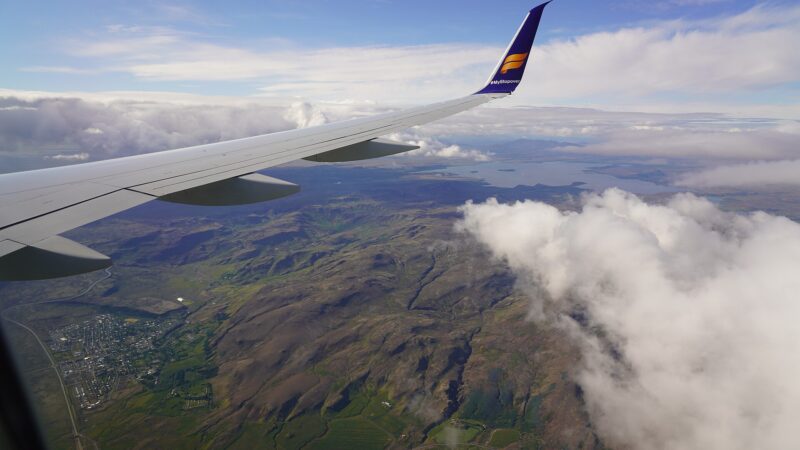 Wingtip and landscape with cloud bank below (Hveragerði)