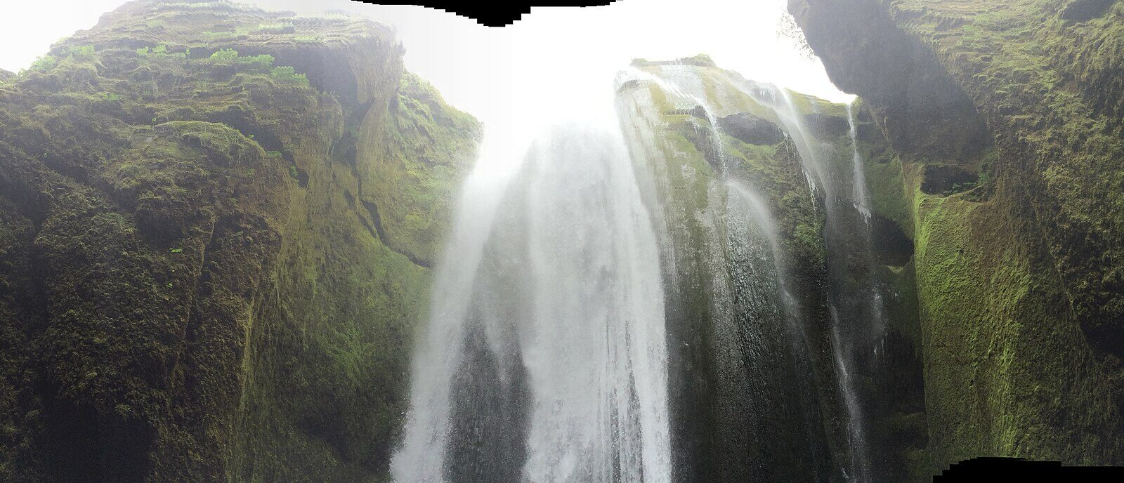 View from inside the canyon up at the waterfall and spray (Gljúfrabúi)