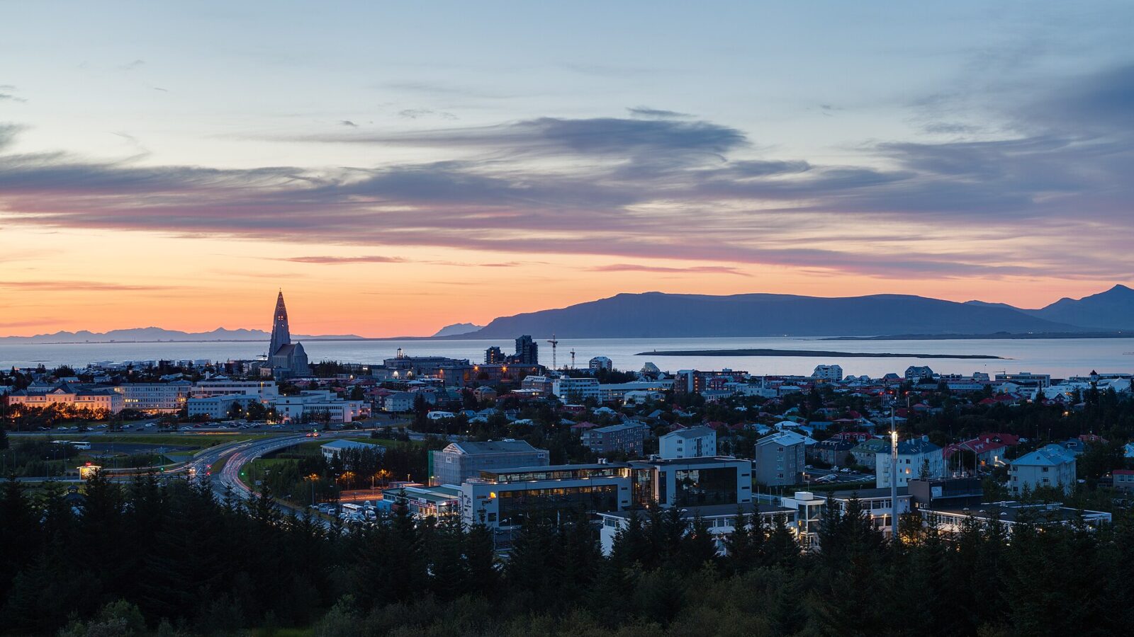 Wide view of the city skyline at dusk with cathedral tower (Reykjavík)