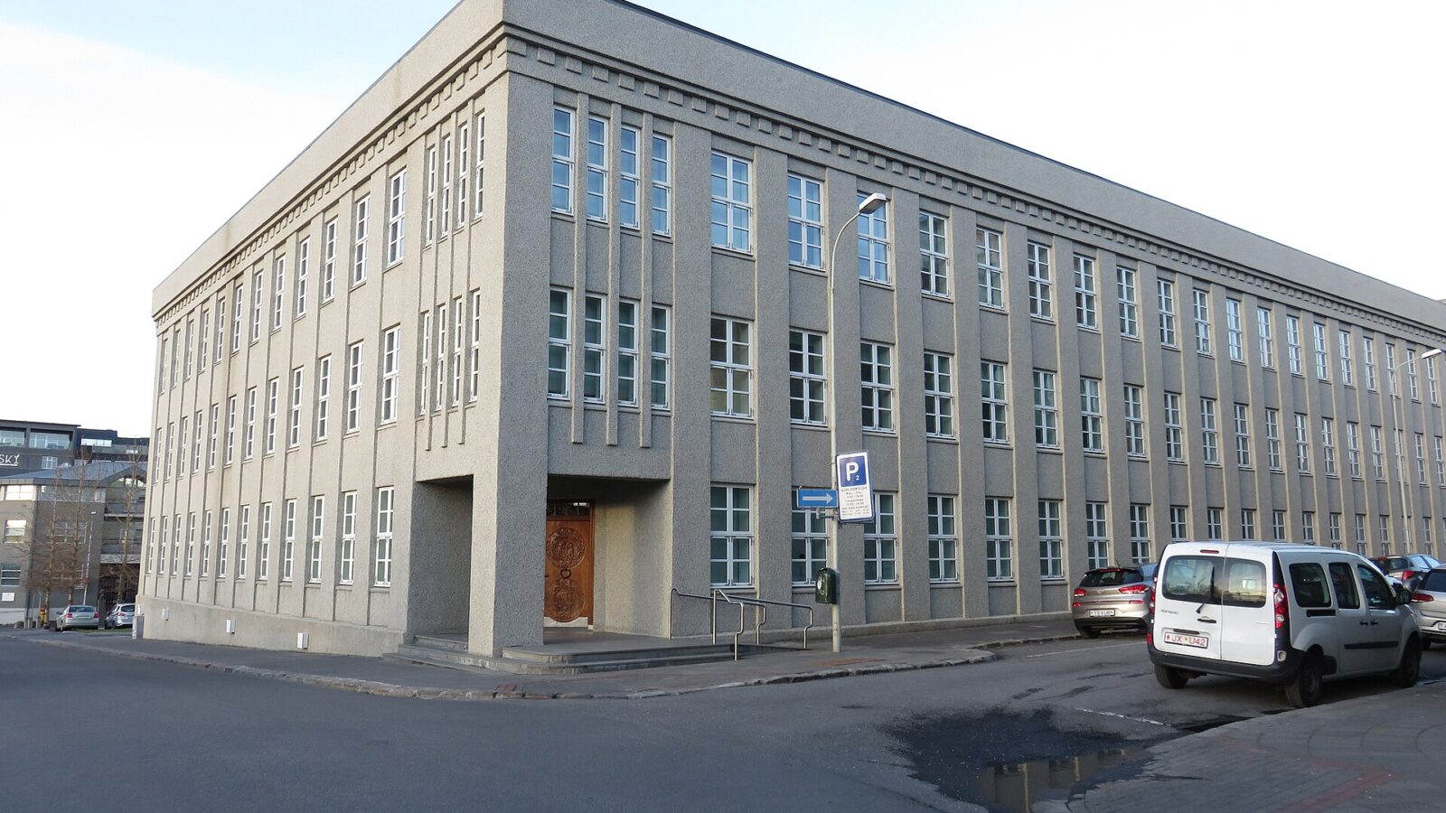 Corner of a gray government-style office building
