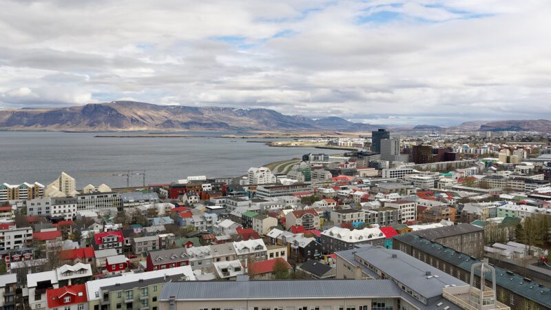 Harbour and residential buildings with distant mountains (Reykjavík)
