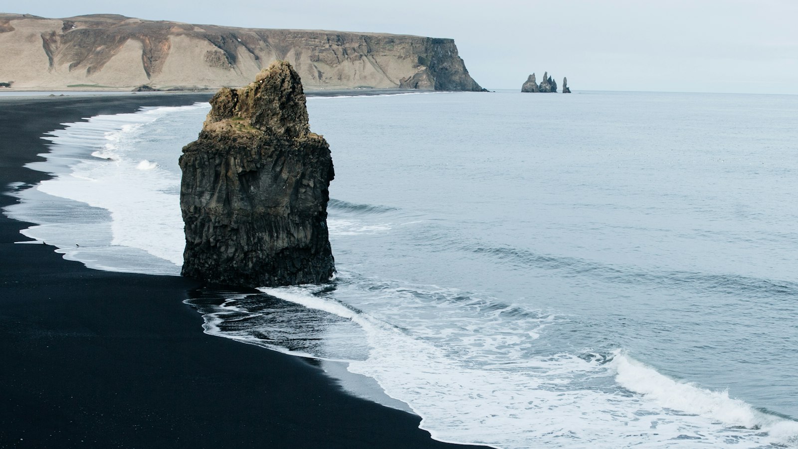 Sea stack on the black sand beach at Vík