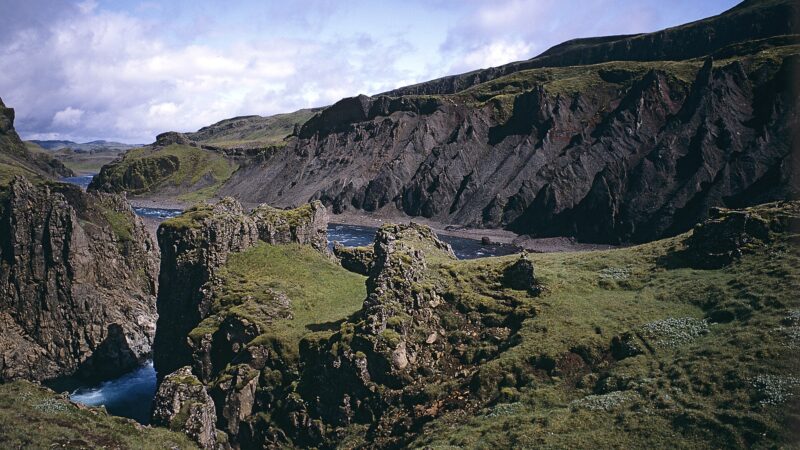 Deep river canyon with rugged cliffs and flowing water (Hrunamannahreppur)