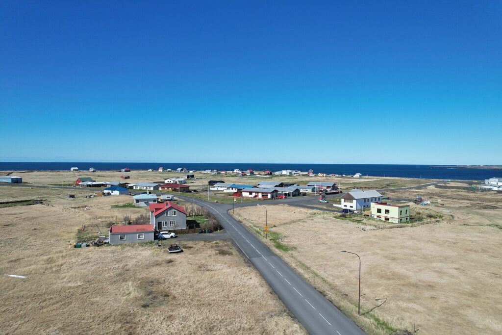 Small coastal settlement with houses facing the sea (Hafnir)