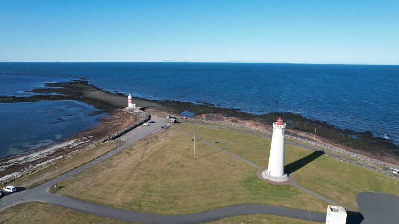 Twin lighthouses on the rocky coast (Garður)