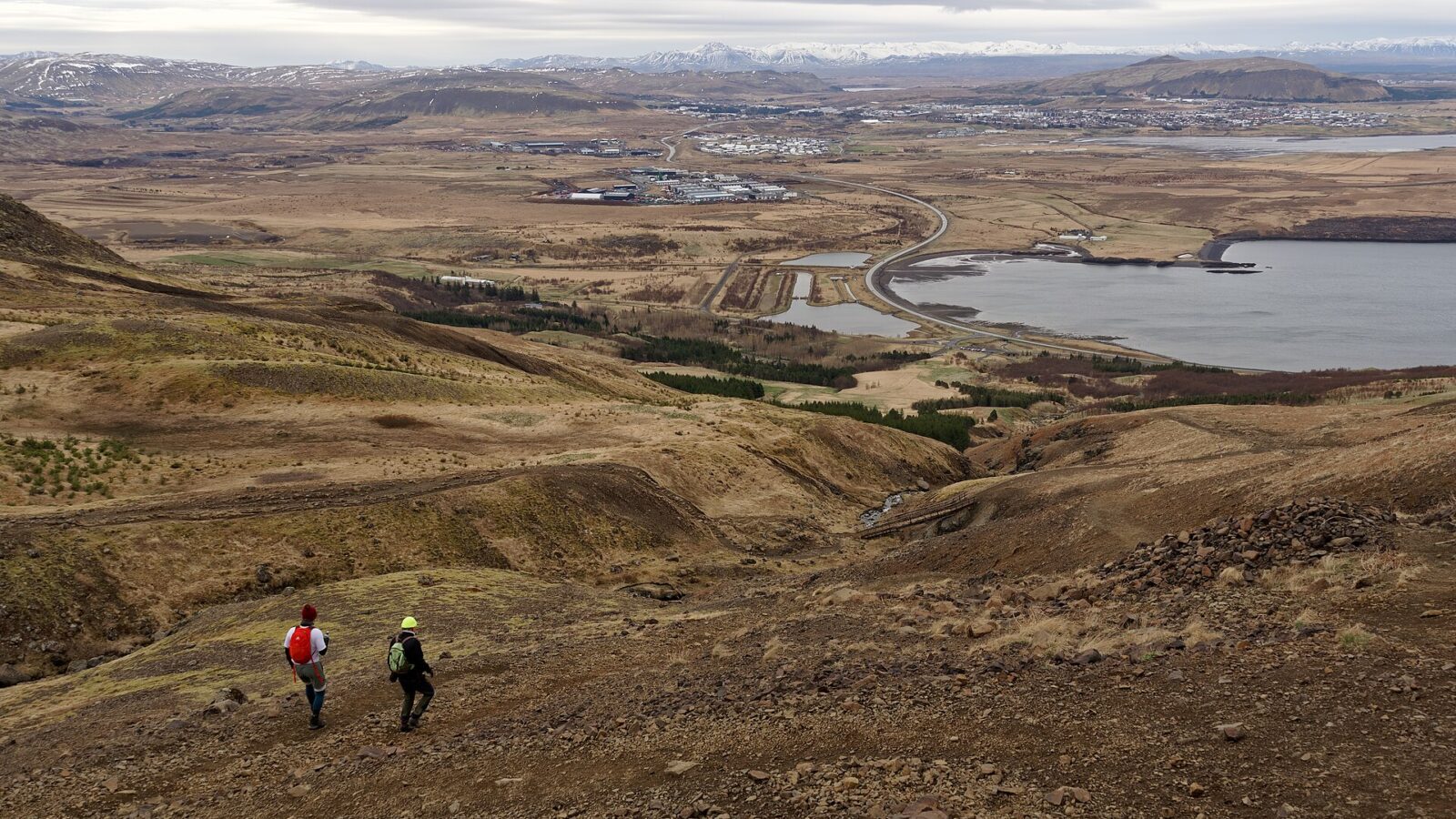 Wide view of town and surrounding coastline from hillside (Mosfellsbær)