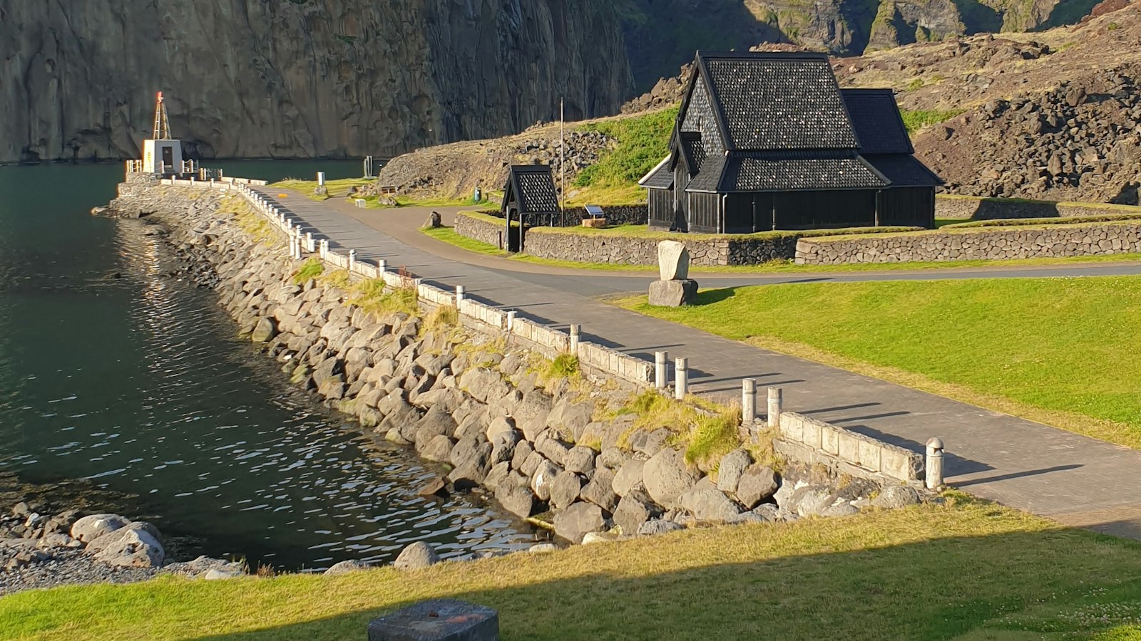Road and stave church by the harbour in Heimaey, Vestmannaeyjar