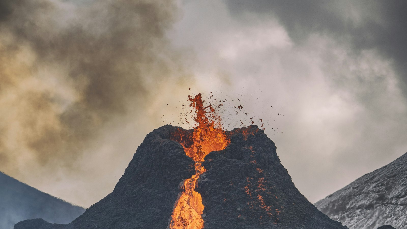Erupting volcano with lava fountain