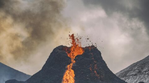 Erupting volcano with lava fountain