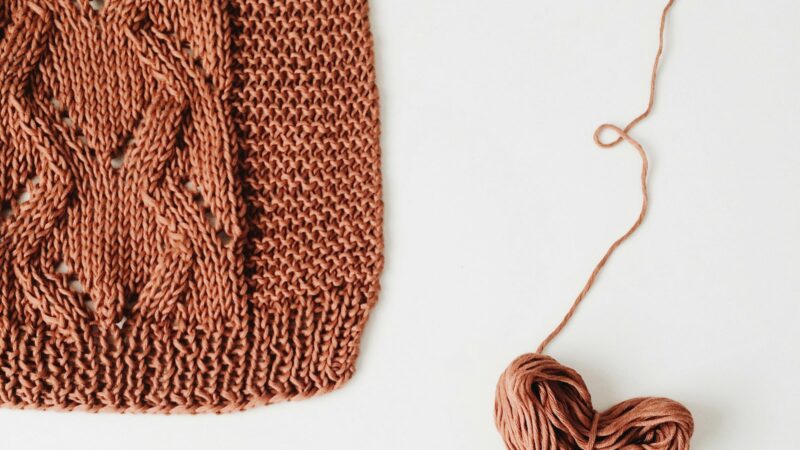 Hand-knitted wool and a ball of yarn