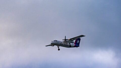 A small propeller plane in the sky over Iceland