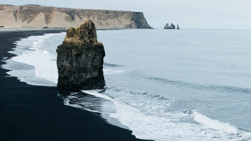 Sea stack on the black sand beach at Vík