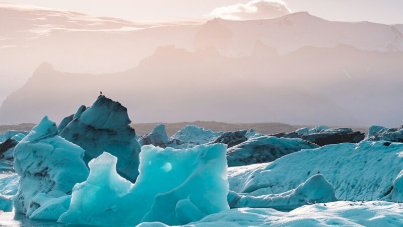 Glacier ice formation under grey sky