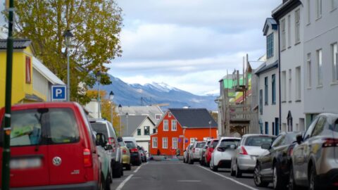 Colourful houses and parked cars on a Reykjavík street