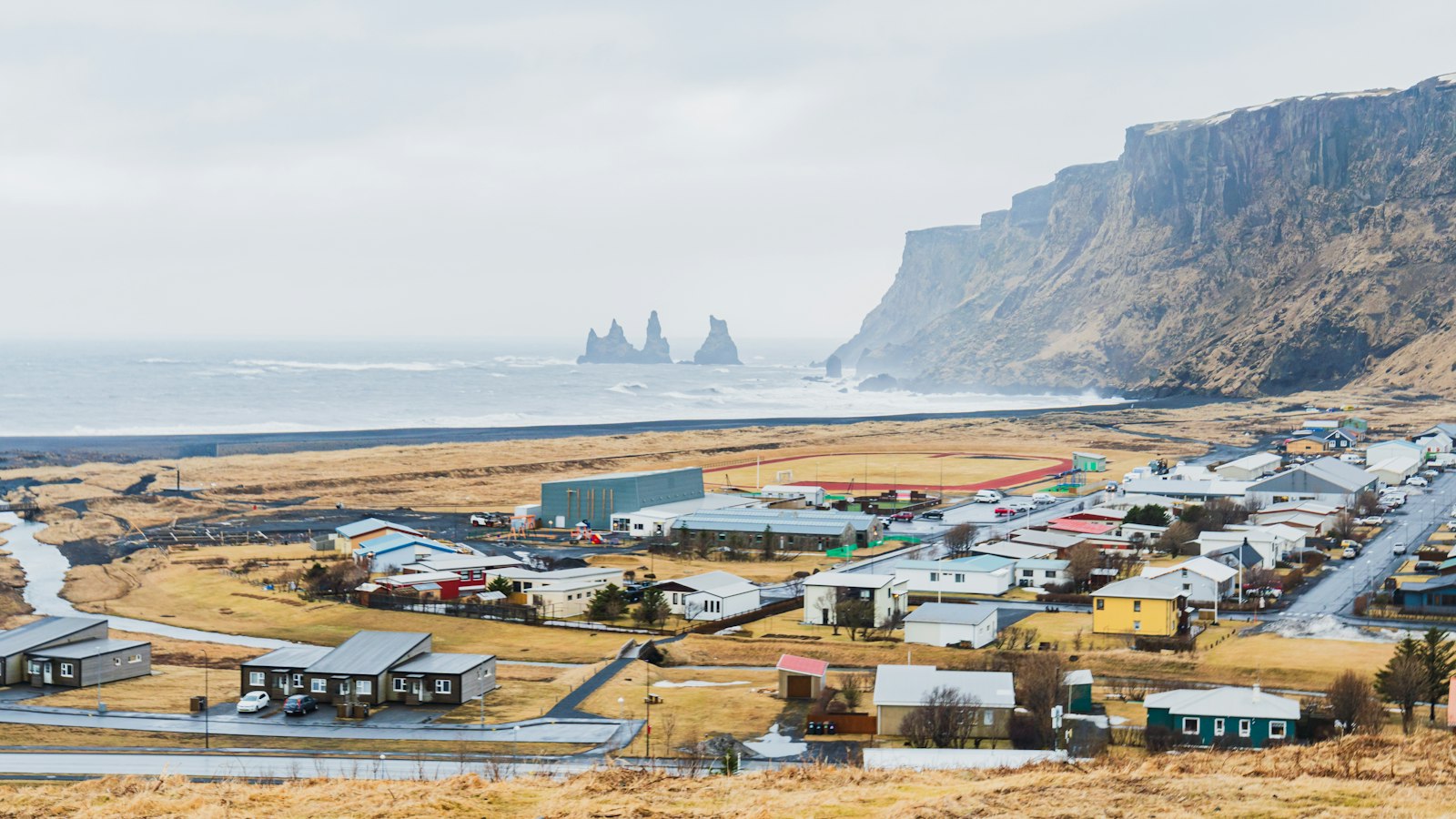Vík village with the Reynisdrangar sea stacks from above